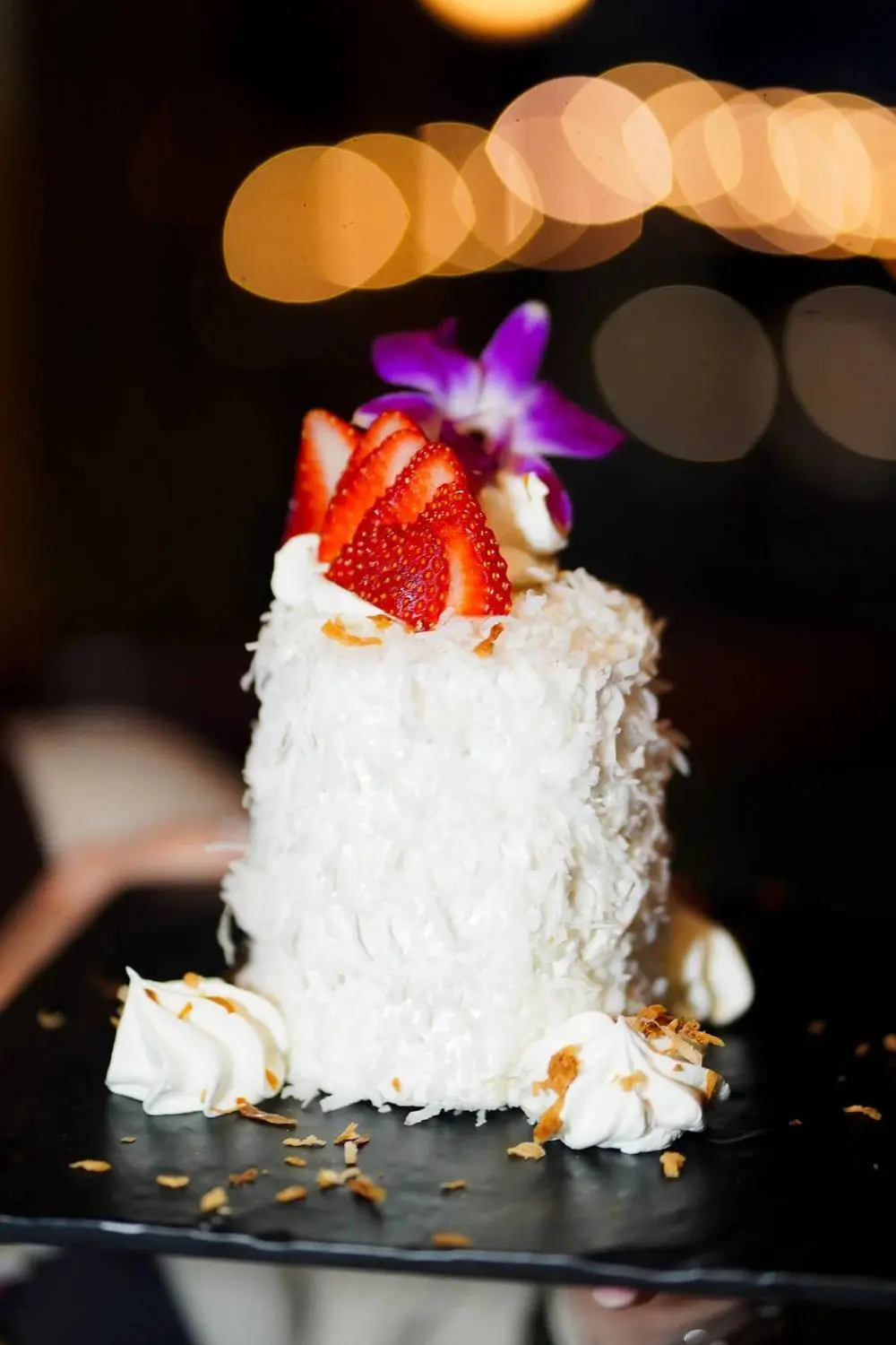 Huggo’s coconut cake with fresh strawberry