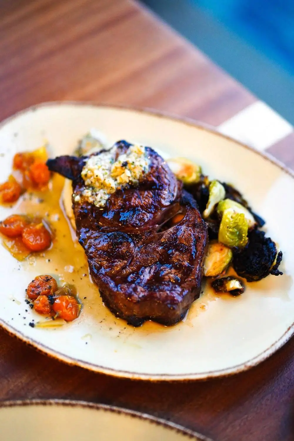 Grilled steak with blistered tomatoes