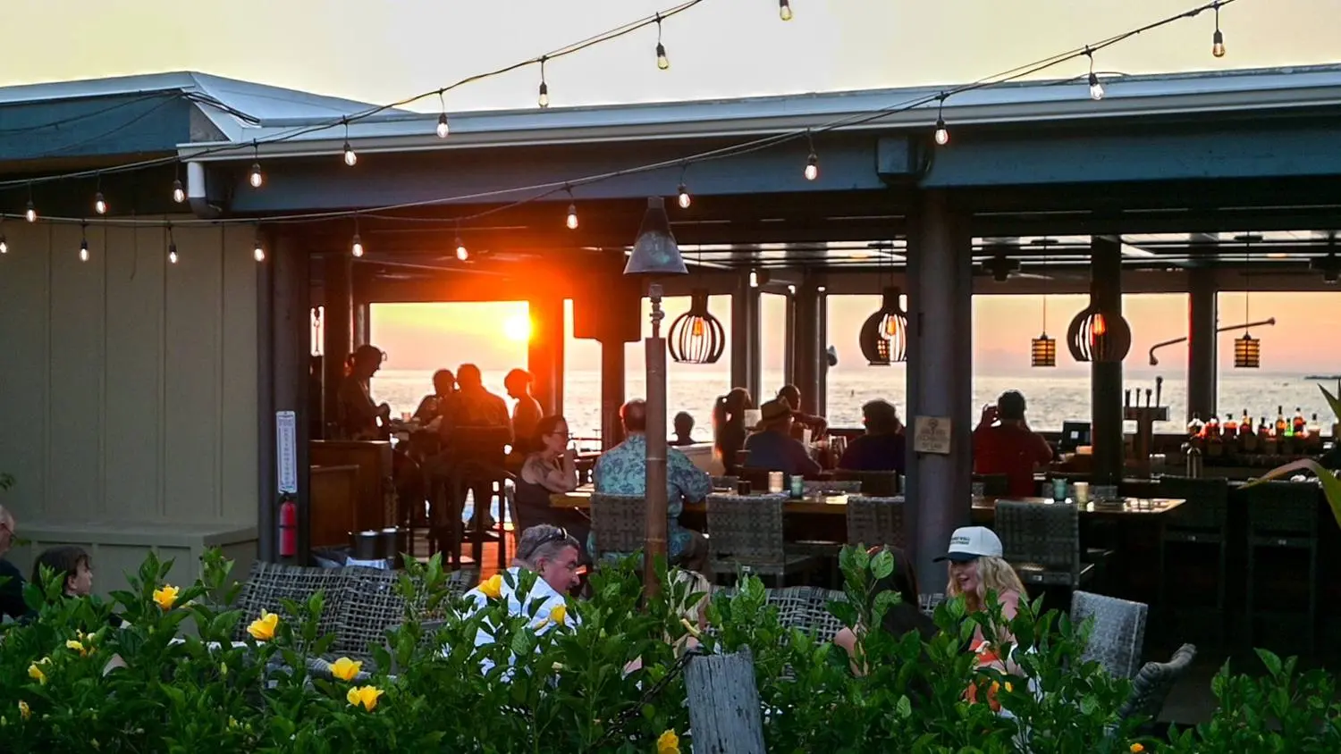 Sunset through the open-air bar at Huggo's