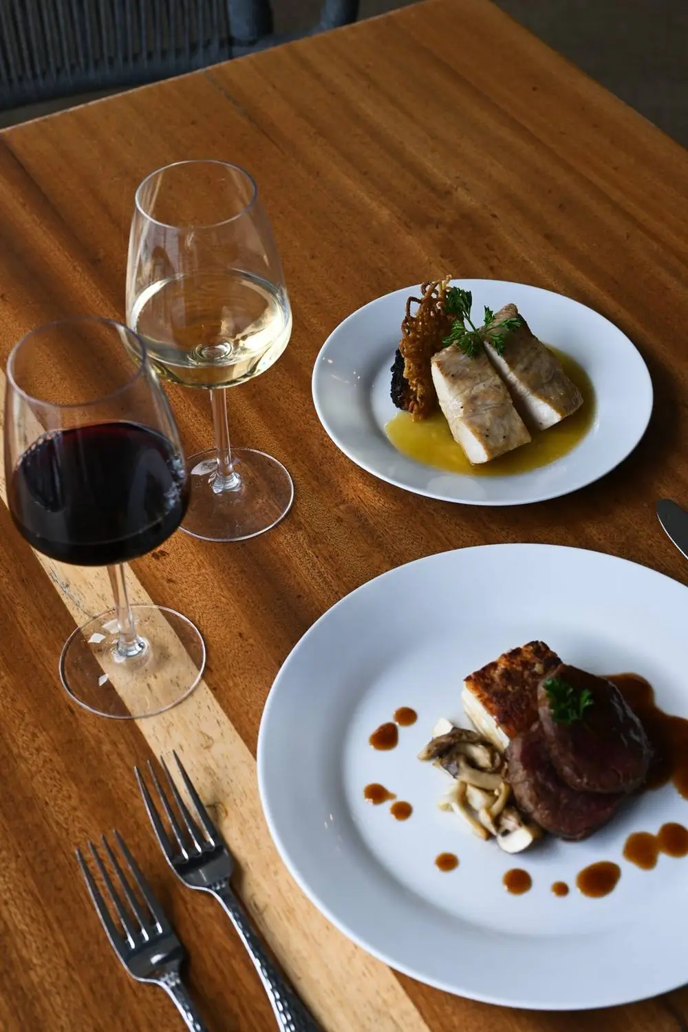 A wine pairing course at a Huggo's dinner